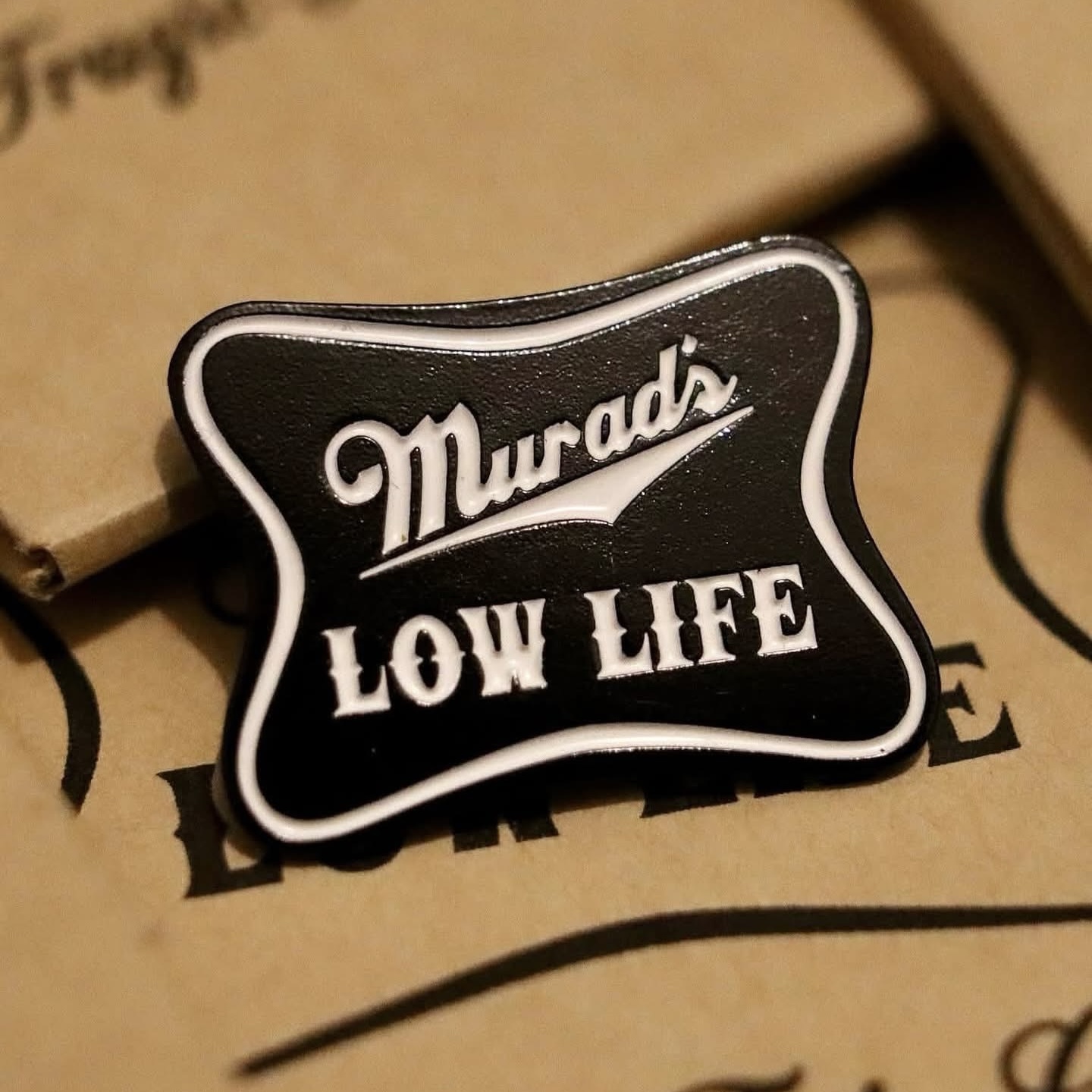 Murad's Low Life Lapel Pin